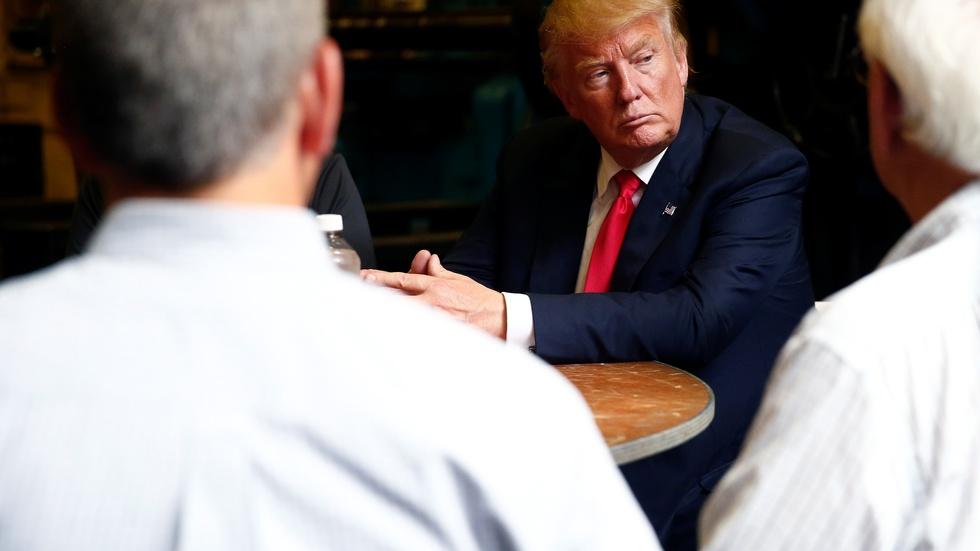 Though trailing in key states, Trump expresses optimism image