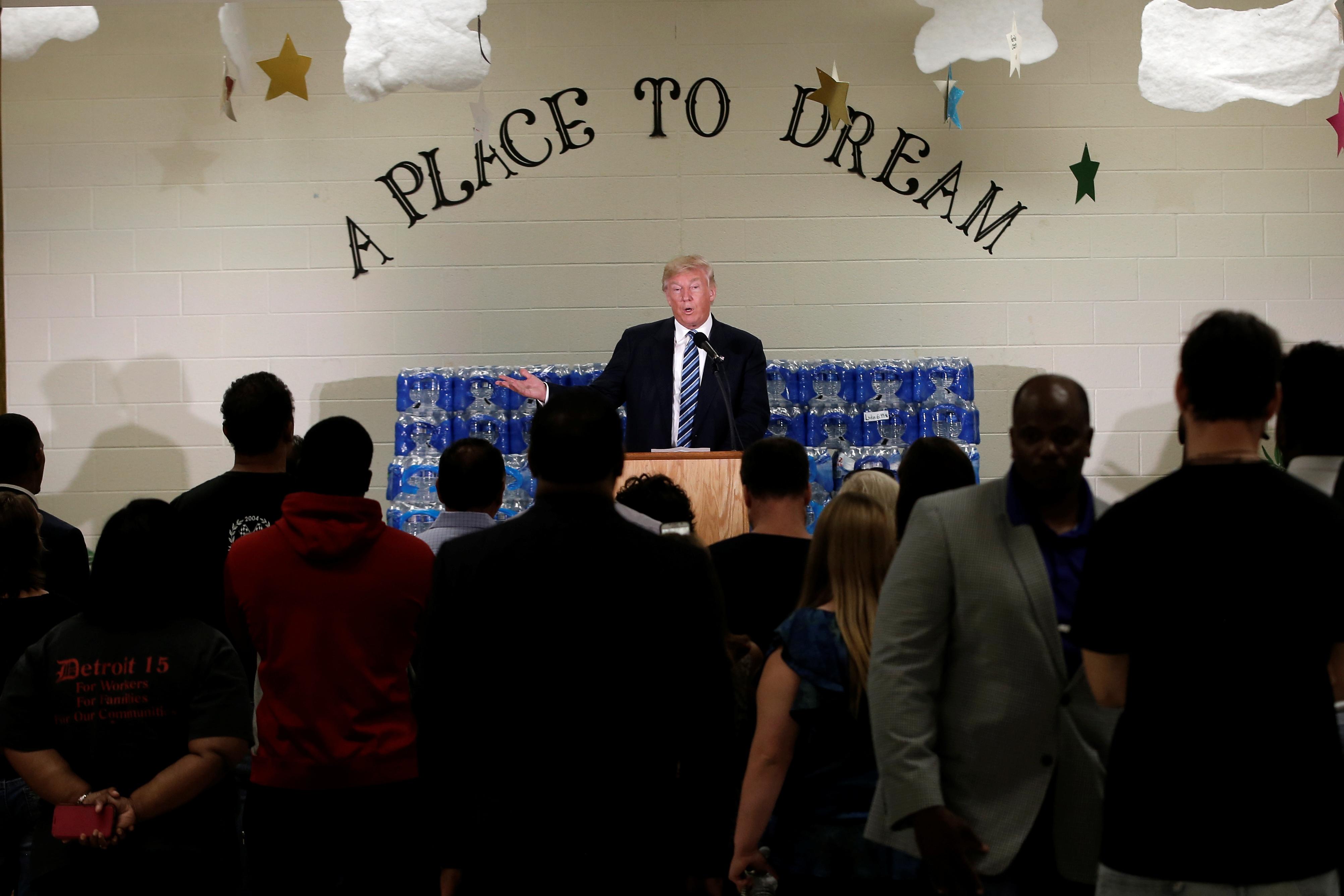 Trump tours Flint water crisis; Clinton releases health info