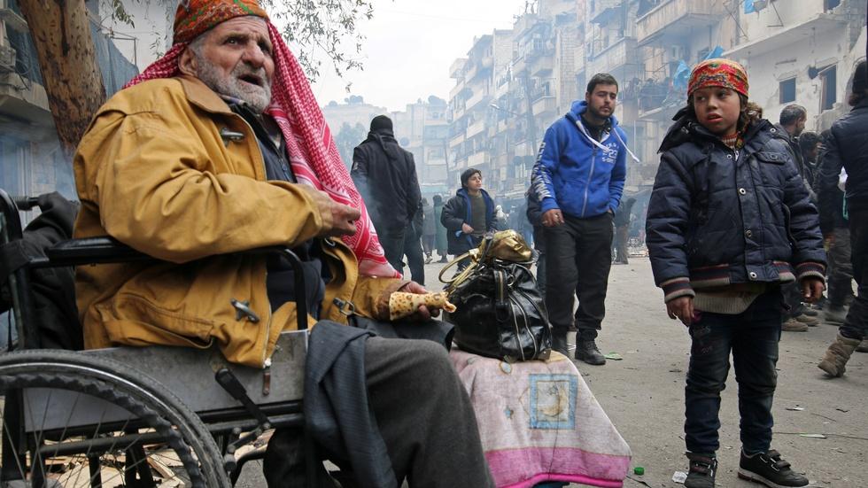 As Aleppo lies in ruins, thousands wait to escape image