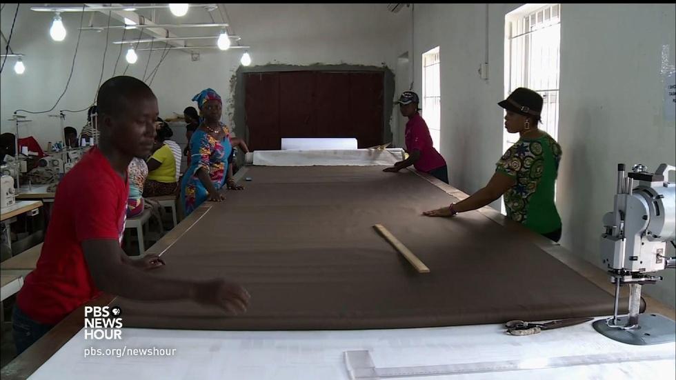 In Liberia, sewing school uniforms with social consciousness image
