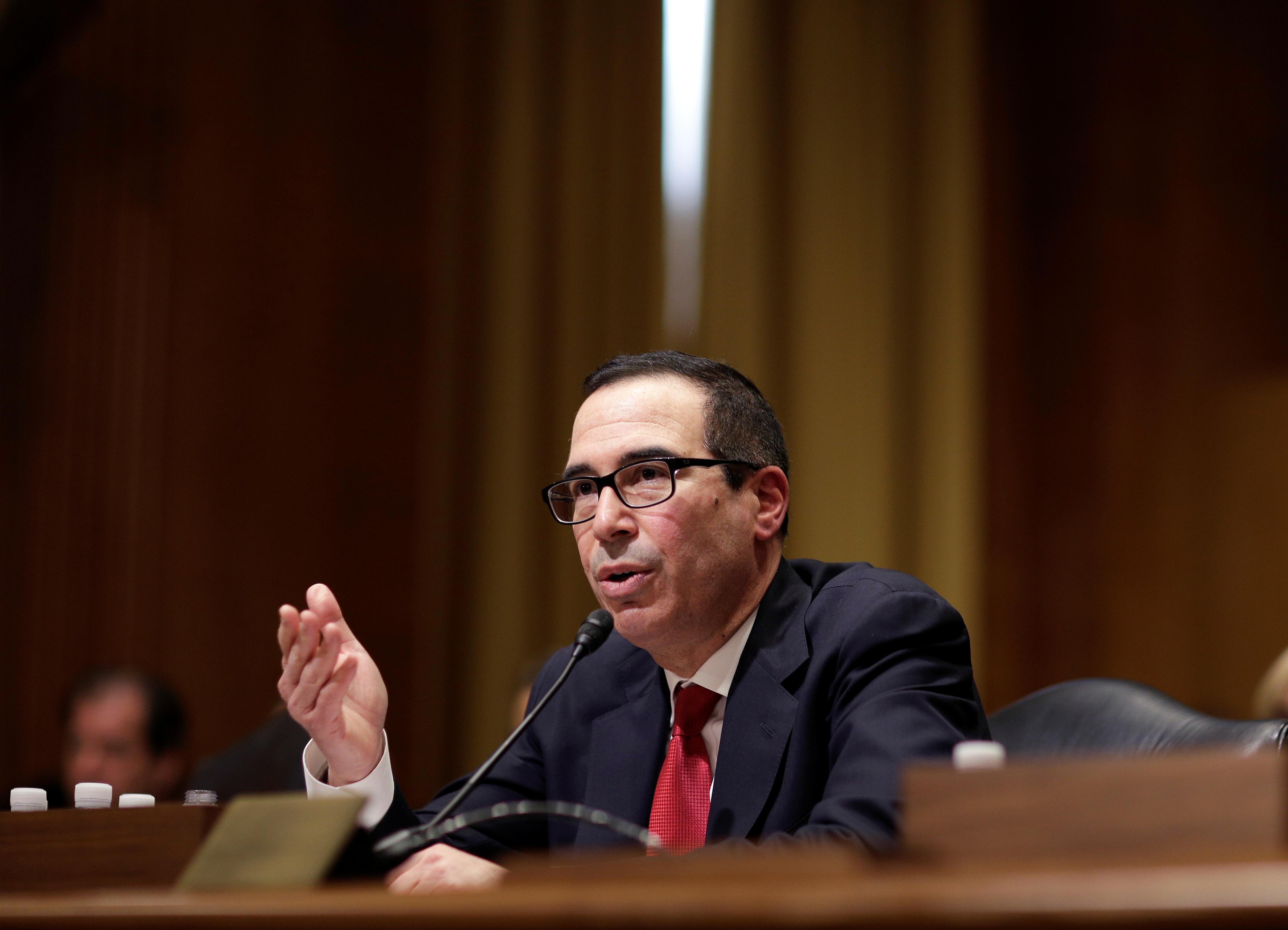 Mnuchin defends record; Perry says his attitude has changed