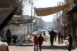 Areas of Mosul still under siege, but signs of life return