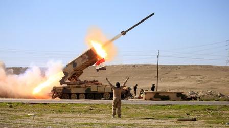 Video thumbnail: PBS NewsHour As battle in Mosul rages on, Iraqi forces bomb ISIS in Syria