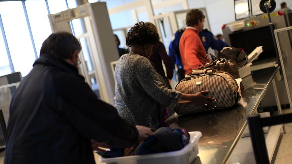 What sparked a new carry-on electronics ban on some flights? image