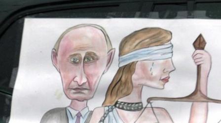 Video thumbnail: PBS NewsHour Despite Opposition, Putin Favored to Claim Presidency Again