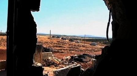 Video thumbnail: PBS NewsHour In Syrian Town, NPR Reporter Sees Blood-Soaked Carpets