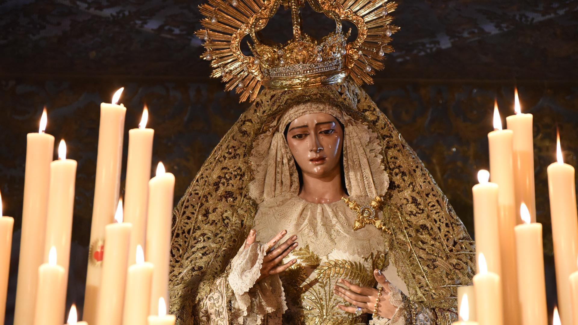 A little child is seen holding a drum. In Spain, Holy Week is called 'Semana  Santa' and it's celebrated with unrivaled pageantry and emotion. It comes  with religious processions around the country