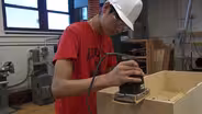 Students earn while they learn hands-on carpentry skills