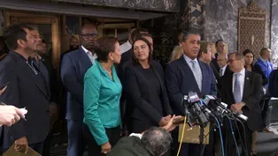 Democrats tour migrant hotel amid anti-immigrant protests