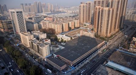 Video thumbnail: PBS NewsHour New evidence tracks COVID's origin to Wuhan market