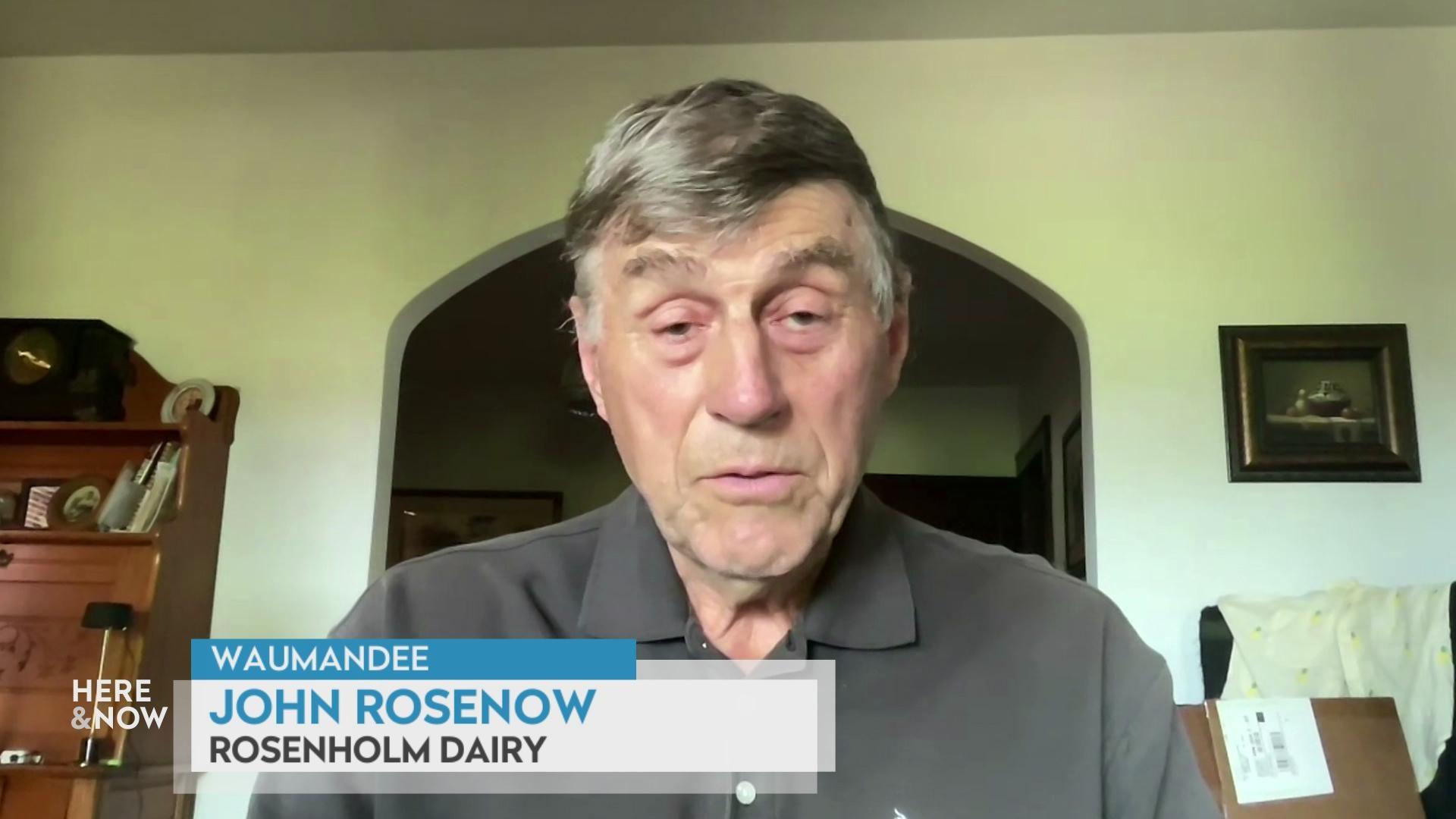 A still image shows John Rosenow seated in front of an archway, with a graphic at the bottom that reads 'Waumandee,' 'John Rosenow' and 'Rosenholm Dairy.'