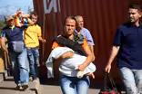 With newly reopened border, Venezuelans flood into Colombia