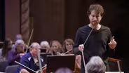 State's oldest orchestra thrives under new conductor