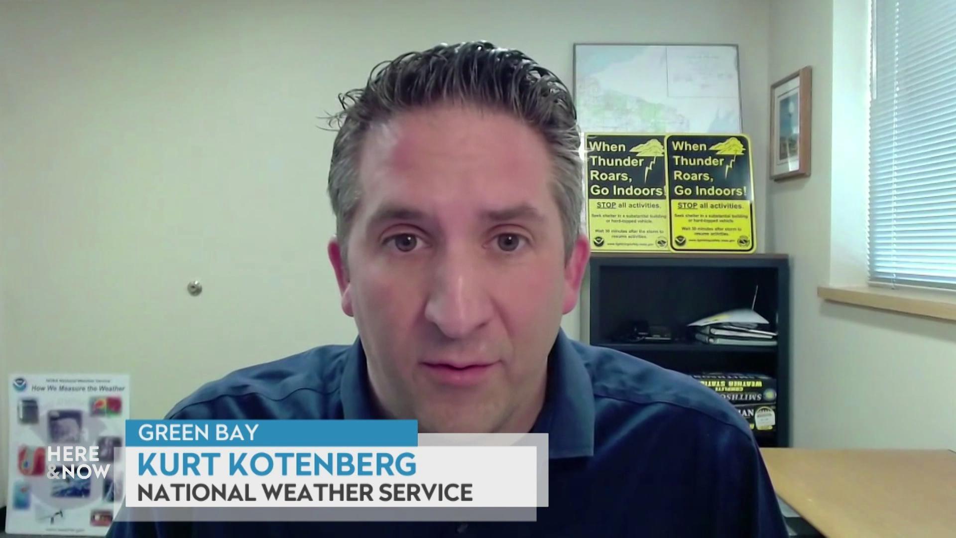 A still image shows Kurt Kotenberg seated in front of two signs that say 'when thunder roars, go indoors' and a graphic at the bottom that reads 'Green Bay,' 'Kurt Kotenberg' and 'National Weather Service.'