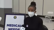 A one-woman campaign urging COVID-19 vaccination