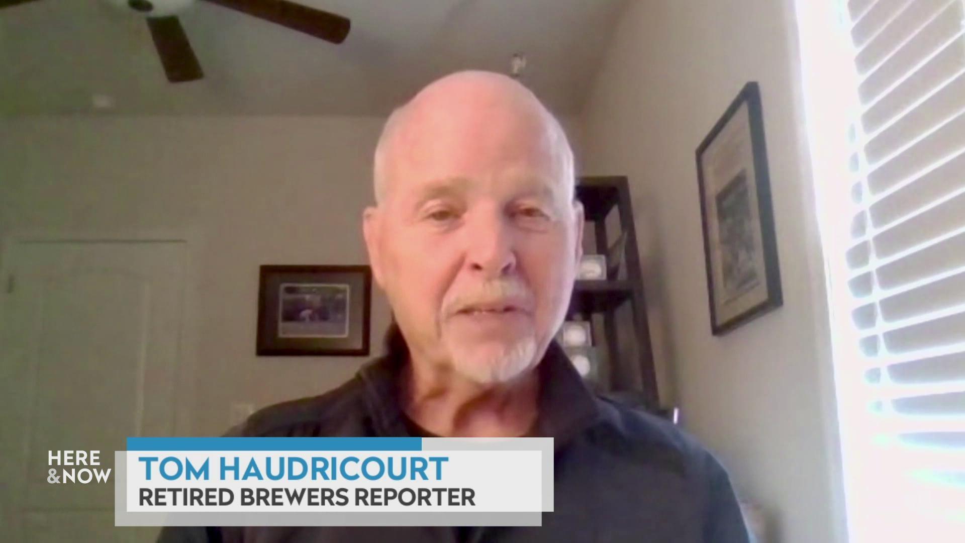 A still image shows Tom Haudricourt seated in front of a bookshelf, with a graphic at the bottom that reads 'Tom Haudricourt' and 'Retired Brewers Reporter.' A still image shows Tom Haudricourt seated in front of a bookshelf, with a graphic at the bottom that reads 'Tom Haudricourt' and 'Retired Brewers Reporter.'