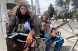 Taliban leaders promise softer rule, but violence persists