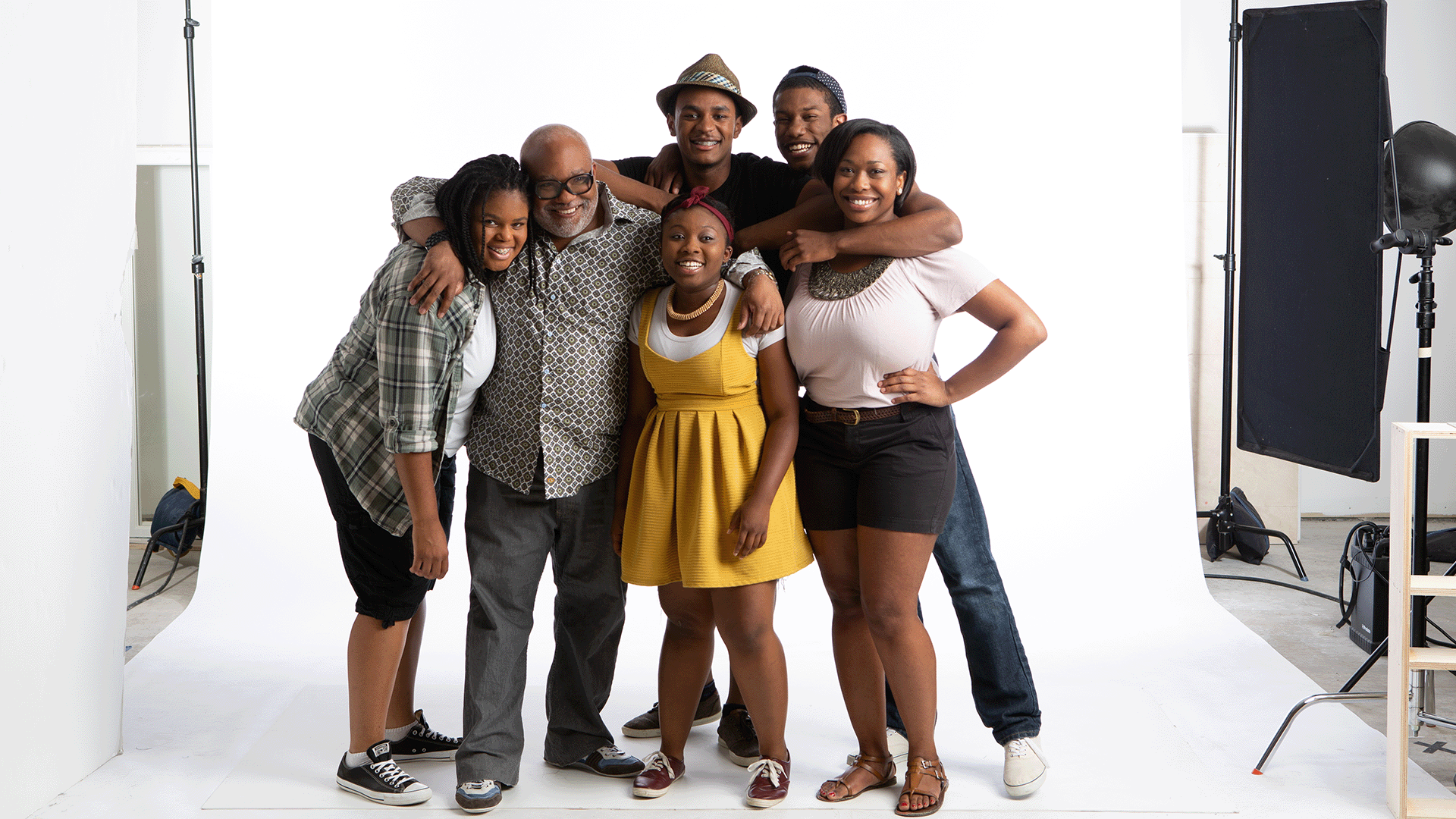 High school cast members from "Purple Dreams" on a studio set.