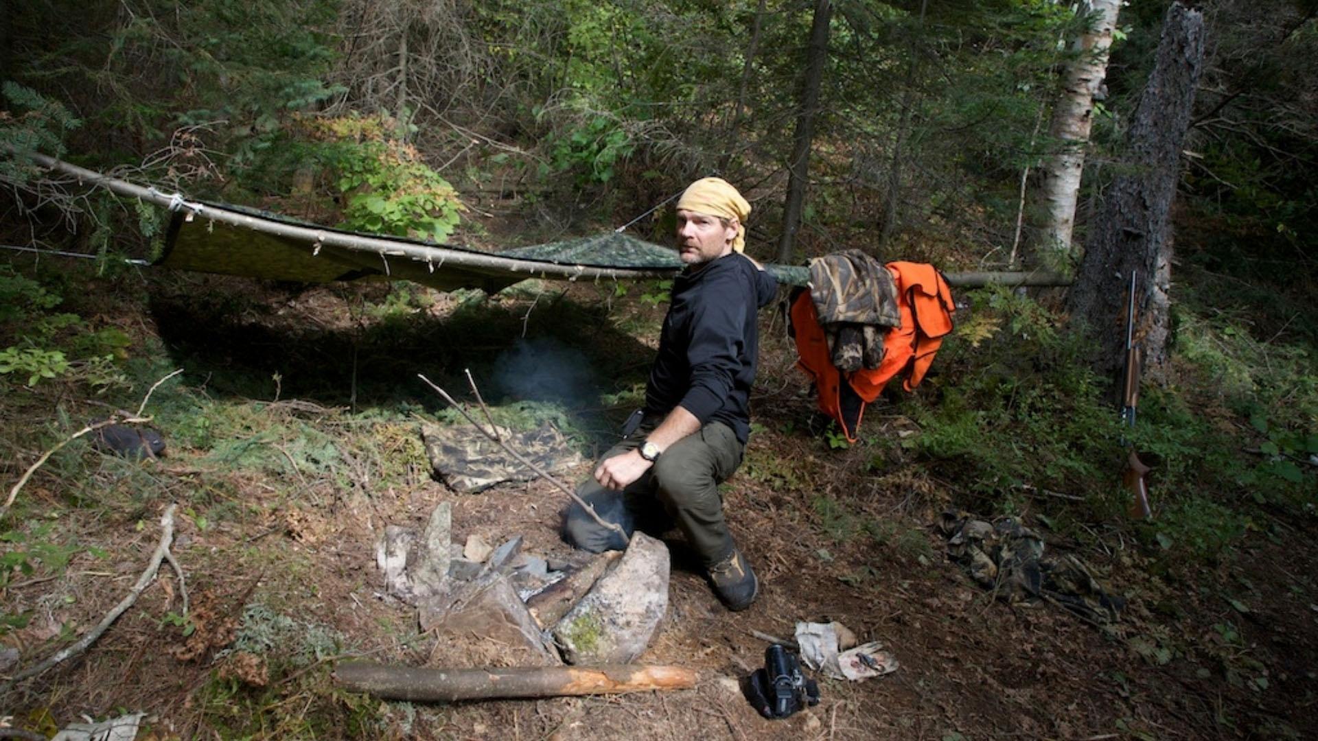 In the Boreal Forest, Stroud intentionally tips his canoe and crawls from the icy waters onto shore.