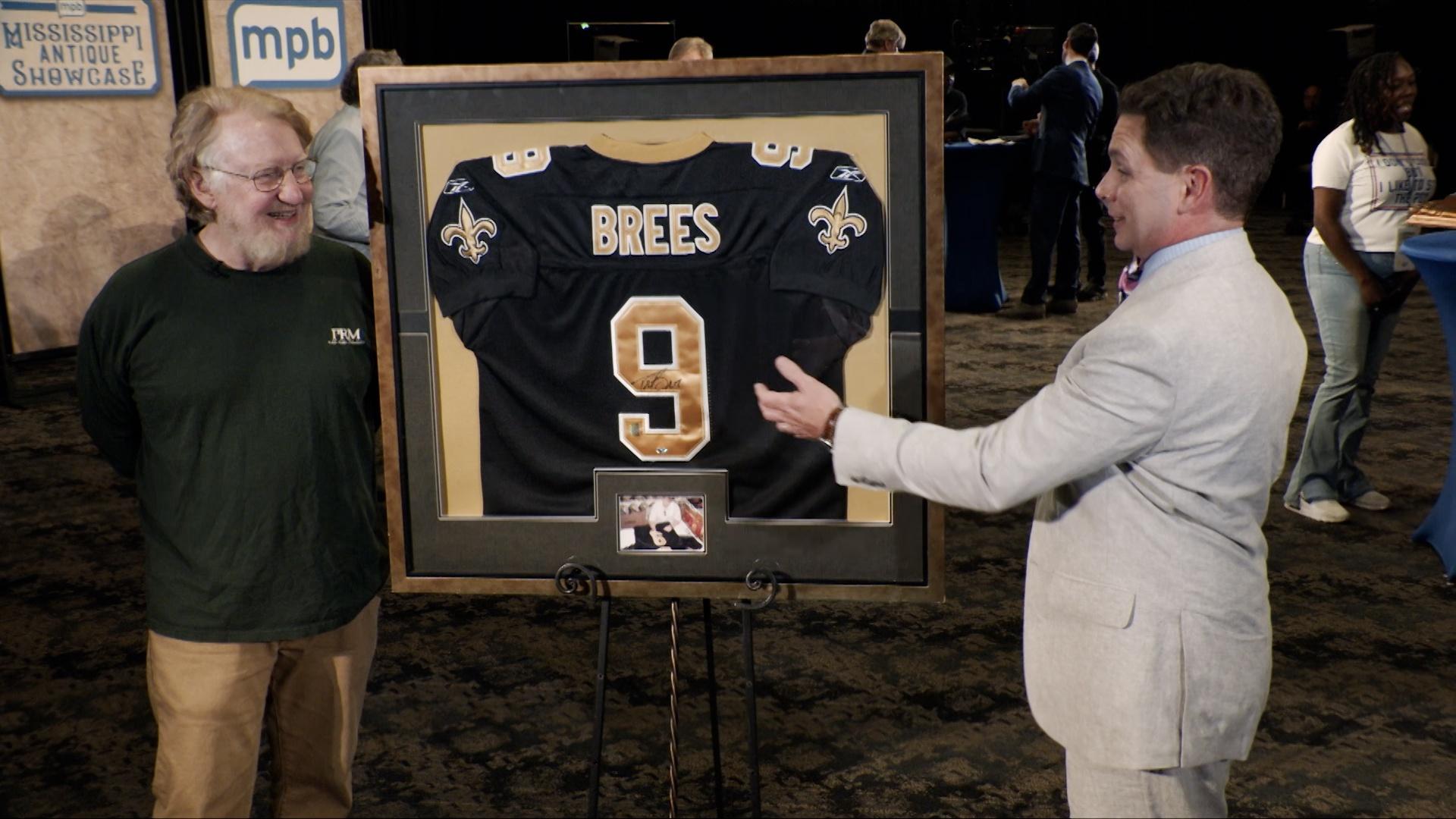 Mardi Gras Gouache art piece, a Faulkner Book, Drew Brees Jersey and a Navajo Blanket.