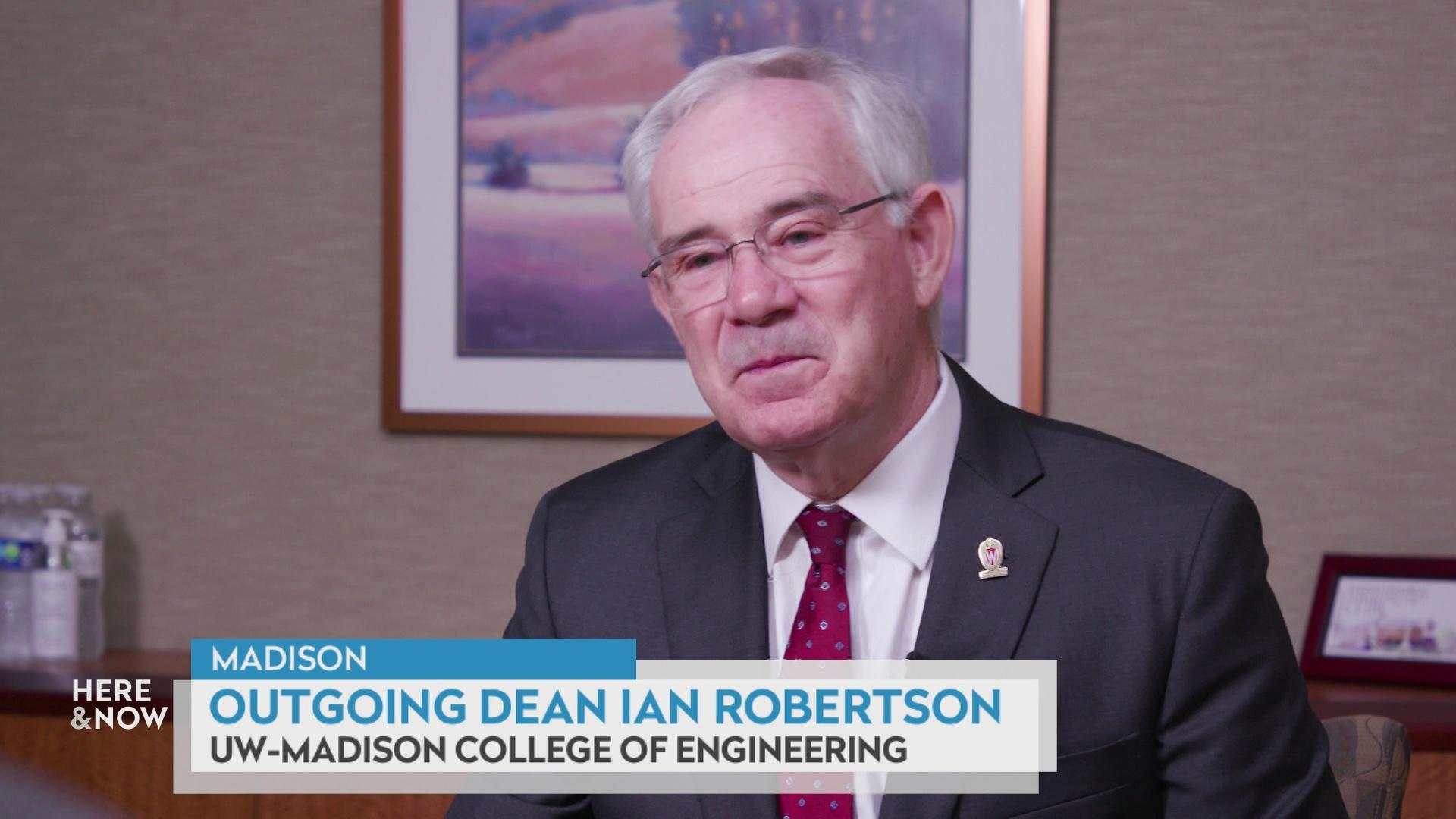 A still image shows Ian Robertson seated in front of framed art on a wall, with a graphic at bottom reading 'Madison,' 'Outgoing Dean Ian Robertson' and 'UW-Madison College of Engineering.'