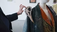 Seattle art show invites visitors to look — and touch