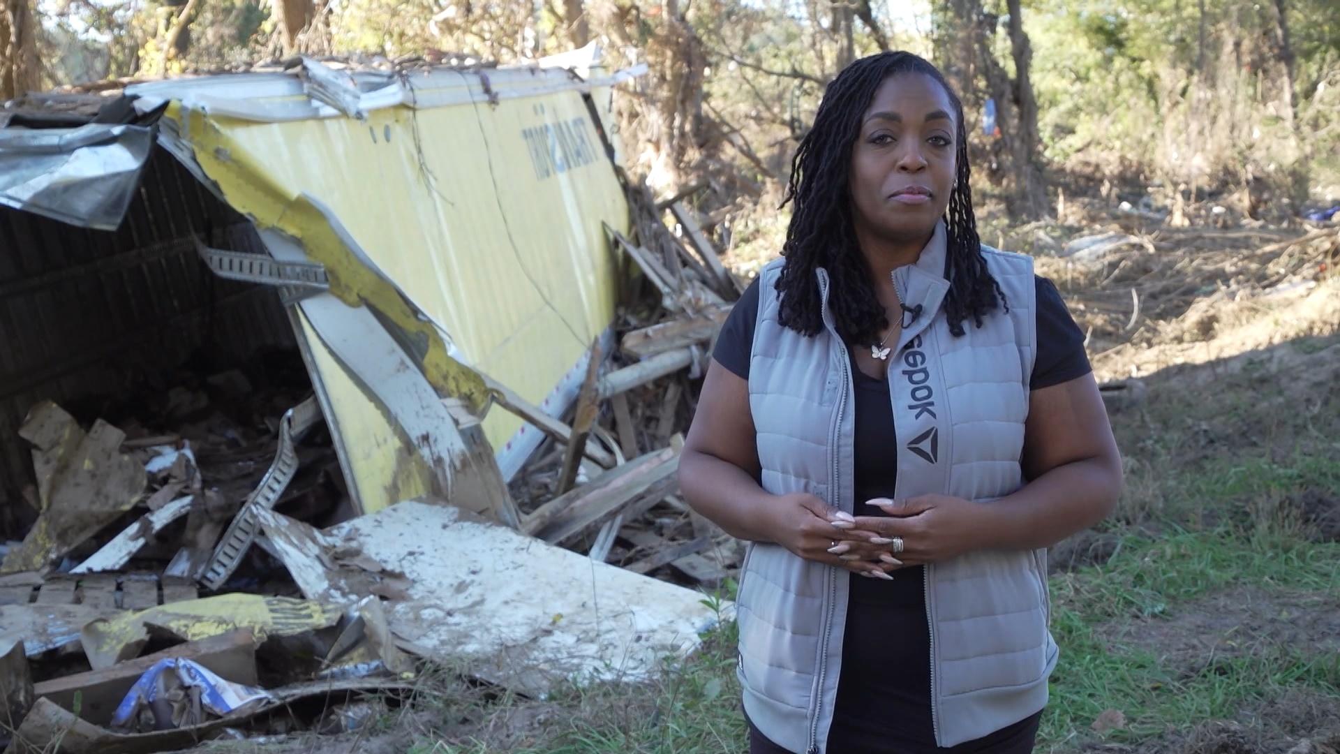 Black Issues Forum host Kenia Thompson in frnot of some rubble left from Hurricane Helene.