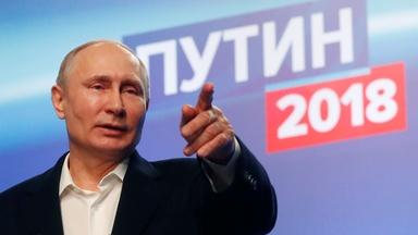 Re-elected by a landslide, Putin projects unchallenged power