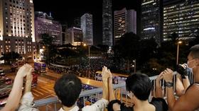Video thumbnail: PBS NewsHour News Wrap: Hong Kong democracy supporters form human chain