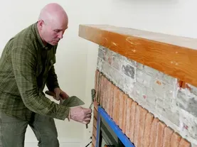 How to Refinish a Fireplace with Brick Veneer